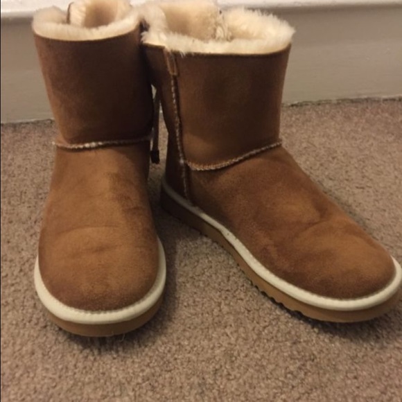 UGG boots with tie in the back.