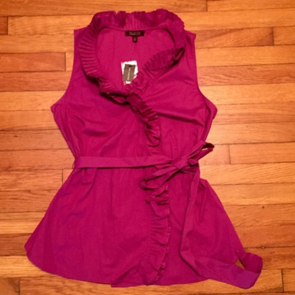 Magenta ruffle blouse, with matching belt.