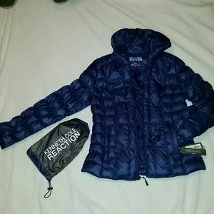 Kenneth Cole dark blue puff jacket in travel bag