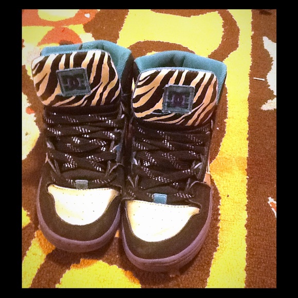 A pair of Dc skater shoes worn 3 or 4 times