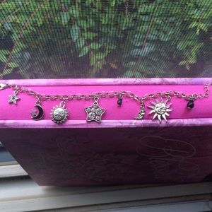 A silver sun moon star charm bracelet