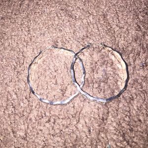 Silver deigned hoops