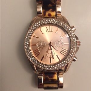 Rose Gold Wrist Watch with Turtle Shell Accent.