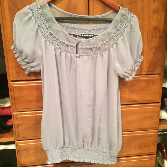 Semi sheer with button detail at the top