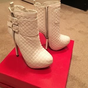 Sexy Ankle heeled boot with buckles.