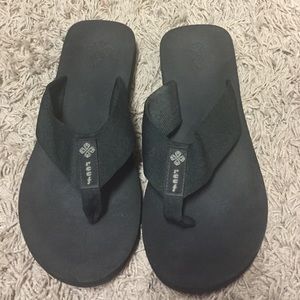 Women's Reef brand black flip flops
