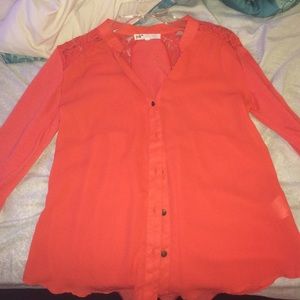 Cute blouse with roll up sleeves and a lace back