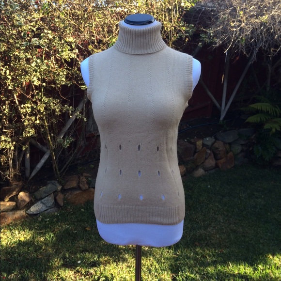 Versace sleeveless turtleneck.