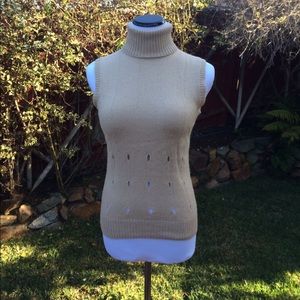 Versace sleeveless turtleneck.