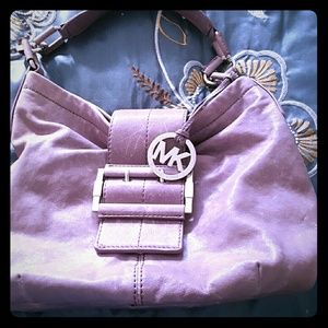 Michael Korrs light purple . Leather purse