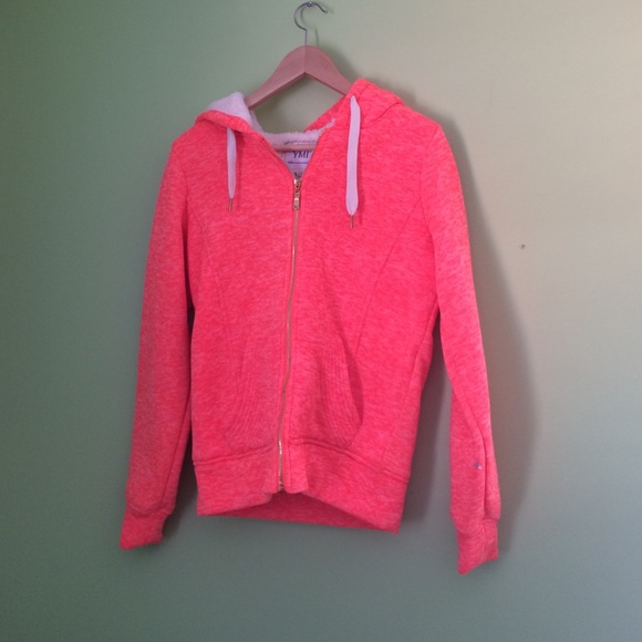 Pink hooded zipper up sweatshirt.