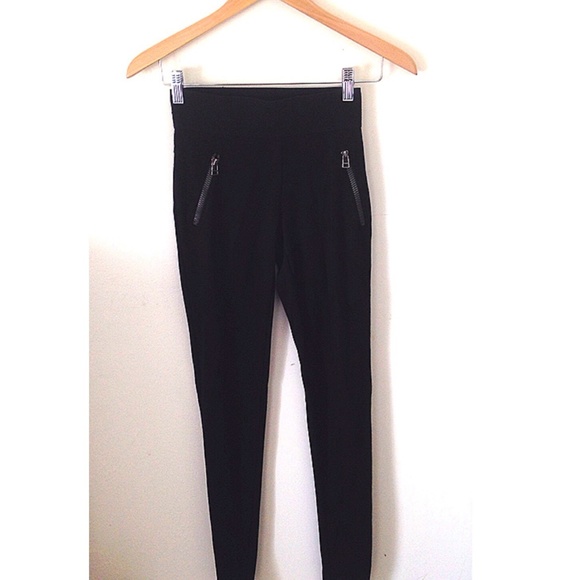 Black elastic banded jeggings with silver zippers