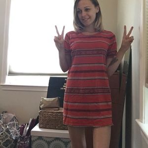 Striped. Patterned. Orange and blue shift dress.