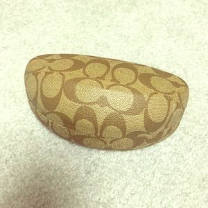 Coach sunglasses case with cleaning cloth.