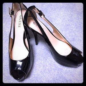 Guess peep toe pumps in patented black.