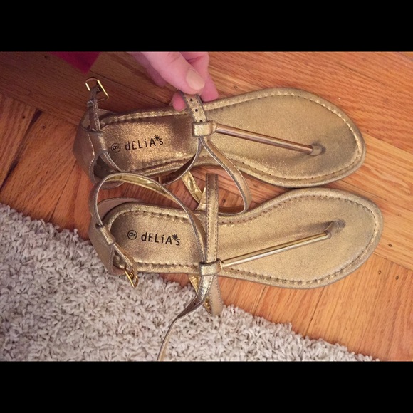 Delias Gold T-strap Sandals - Picture 1 of 3