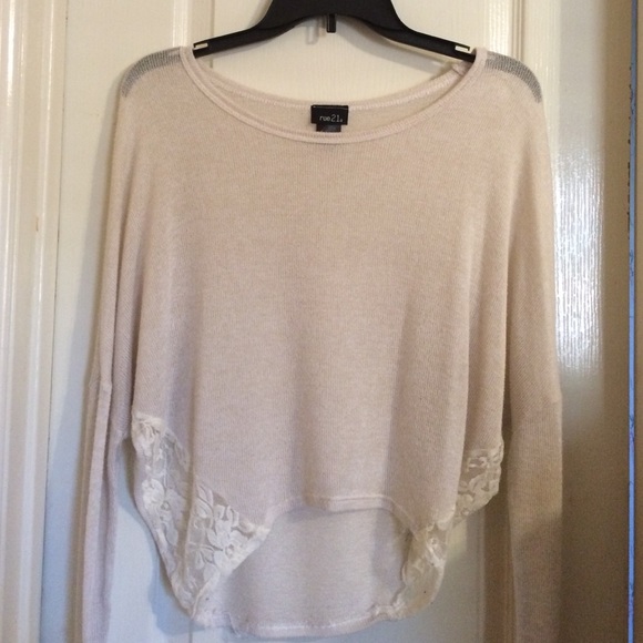 Beige colored long sleeved shirt