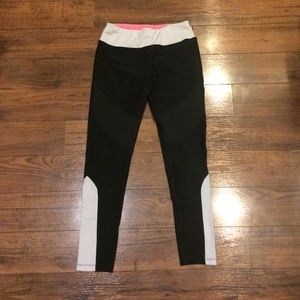 Black leggings with mesh and striped detailing