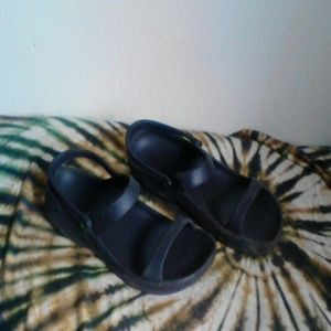 Croc like sandals. "Dawgs"