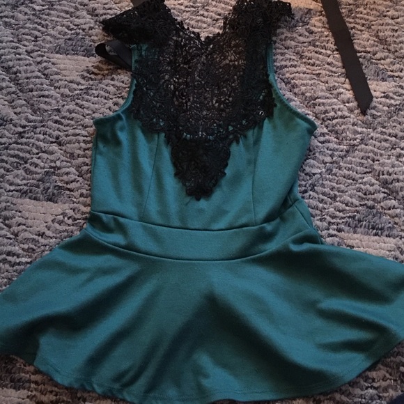 Green and black peplum top