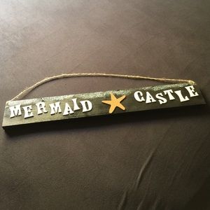 Mermaid castle sign