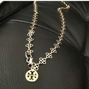 Tory Burch gold necklace with clasp.