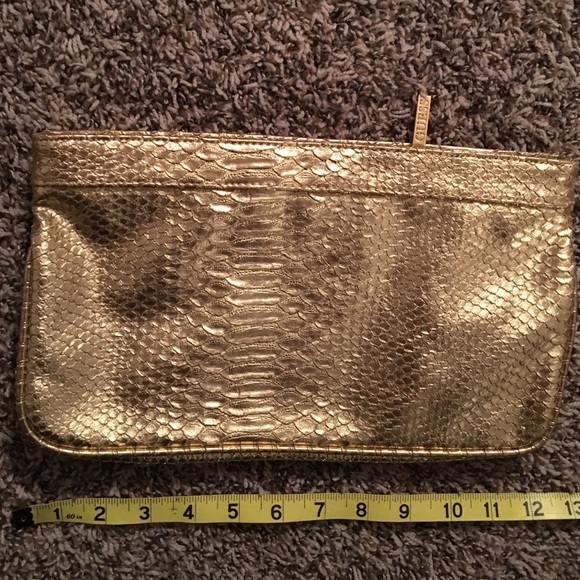 SOLD Guess gold clutch bag