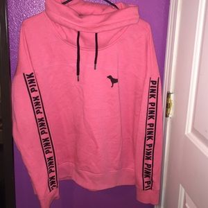 A pink Victoria's Secret PINK turtle neck jacket.