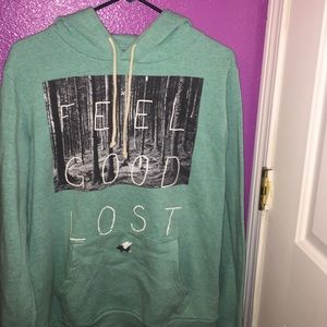 A large hoodie that read "Feel Good Lost"