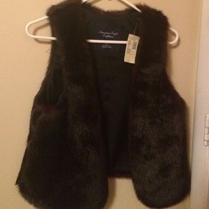 New with tags. Maroon faux fur vest