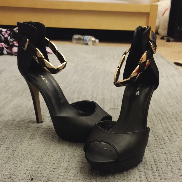 Call it spring gold and black heels