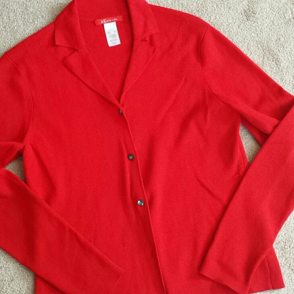 A very light weight buttonup sweater or top