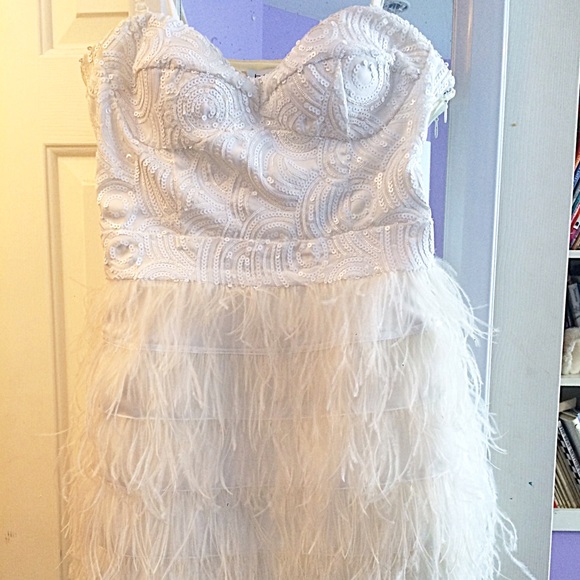 SOLD Brand new white Bebe sequin and feather dress