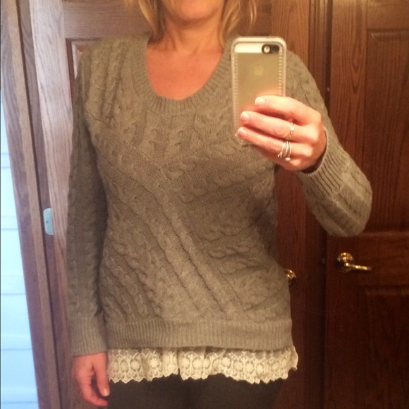 Grey sweater with lace.