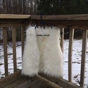 White fur vest