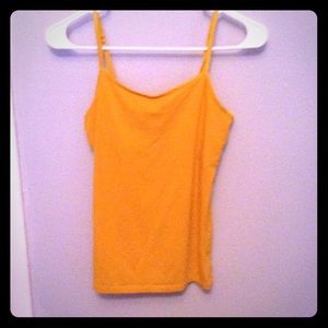 A mustard yellow tank top