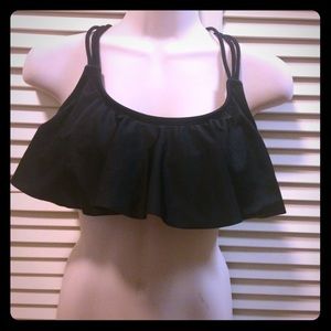 Black VS swim top and Gold & Black Sweater