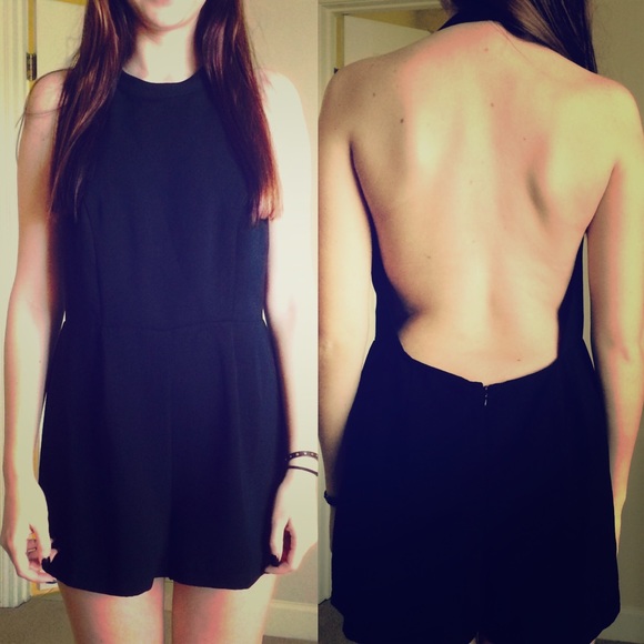 Black romper with a open back.