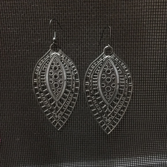 silver feather-like earrings
