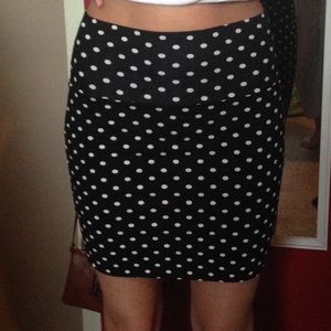 Black and white polka dot skirt.