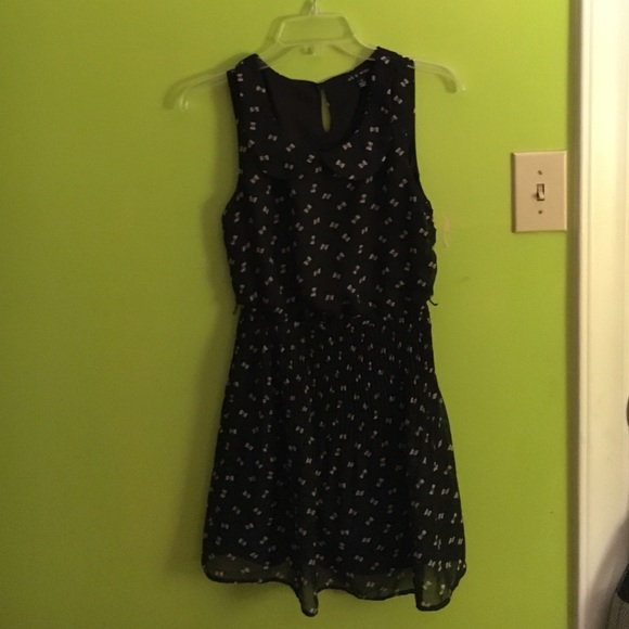Black dress with white bows on them