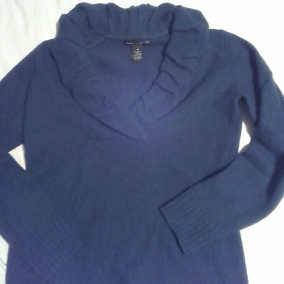 Teal green sweater.