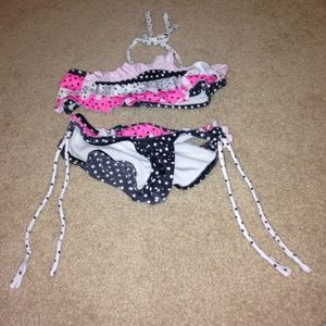 Pink white and black bikini top and bottom.
