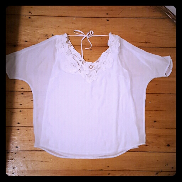 Backless floral-lined white blouse