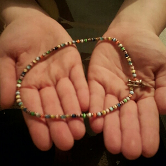 Beaded necklace by a jewlry show.