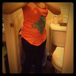 Orange parterned tank top with blue patern