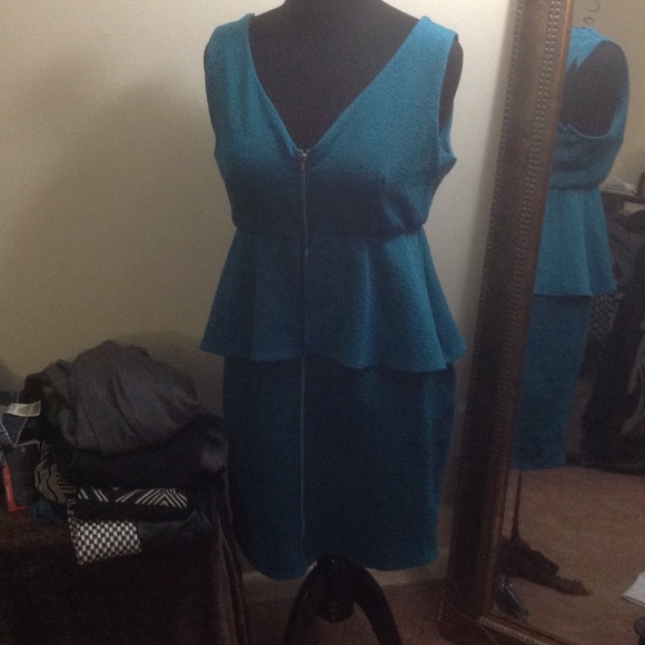 Green/Teal Peplum dress with silver front zipper.