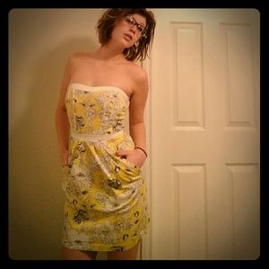 Strapless Yellow dress with white flowers.