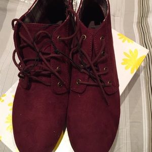 Burgundy laced booties.