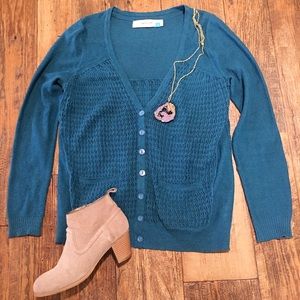 Blue Anthropologie sweater.